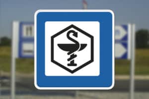 Servicetavle der viser vej mod apotek Seri Q Sign